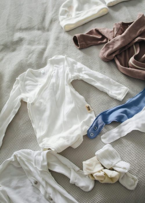pexels-polina-tankilevitch-3875080 Your newborn will mostly be skin-to-skin, swaddled by the nurses, or sleeping in just a diaper under a warm blanket. Save the cute outfits for home when you're settled with your baby.